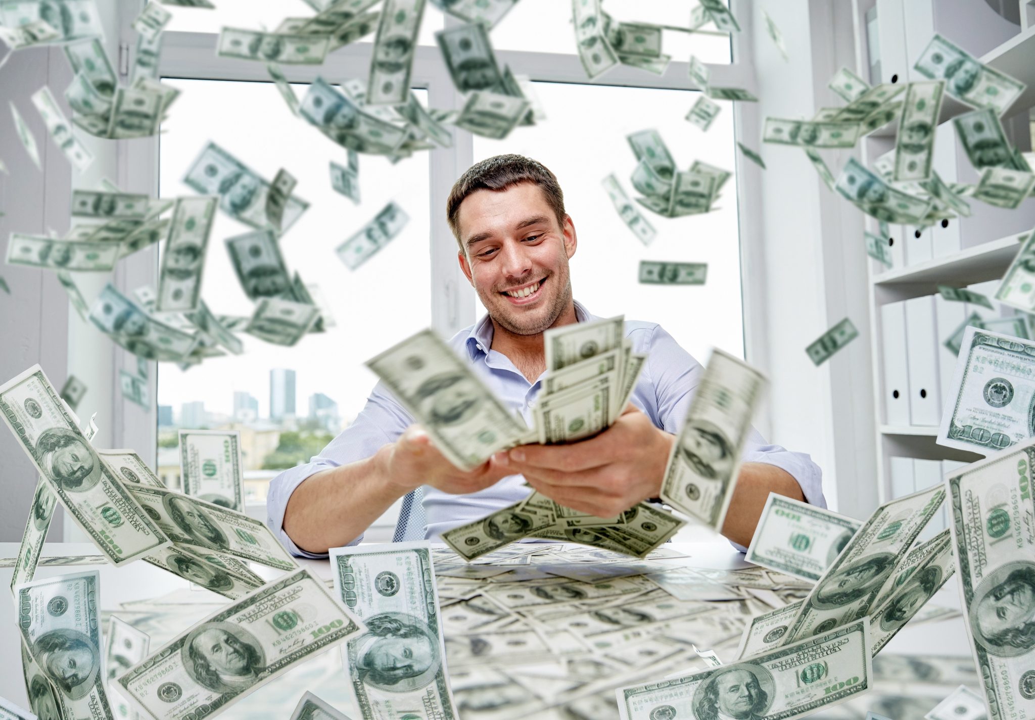 happy businessman with heap of money - Check Cashing Plus